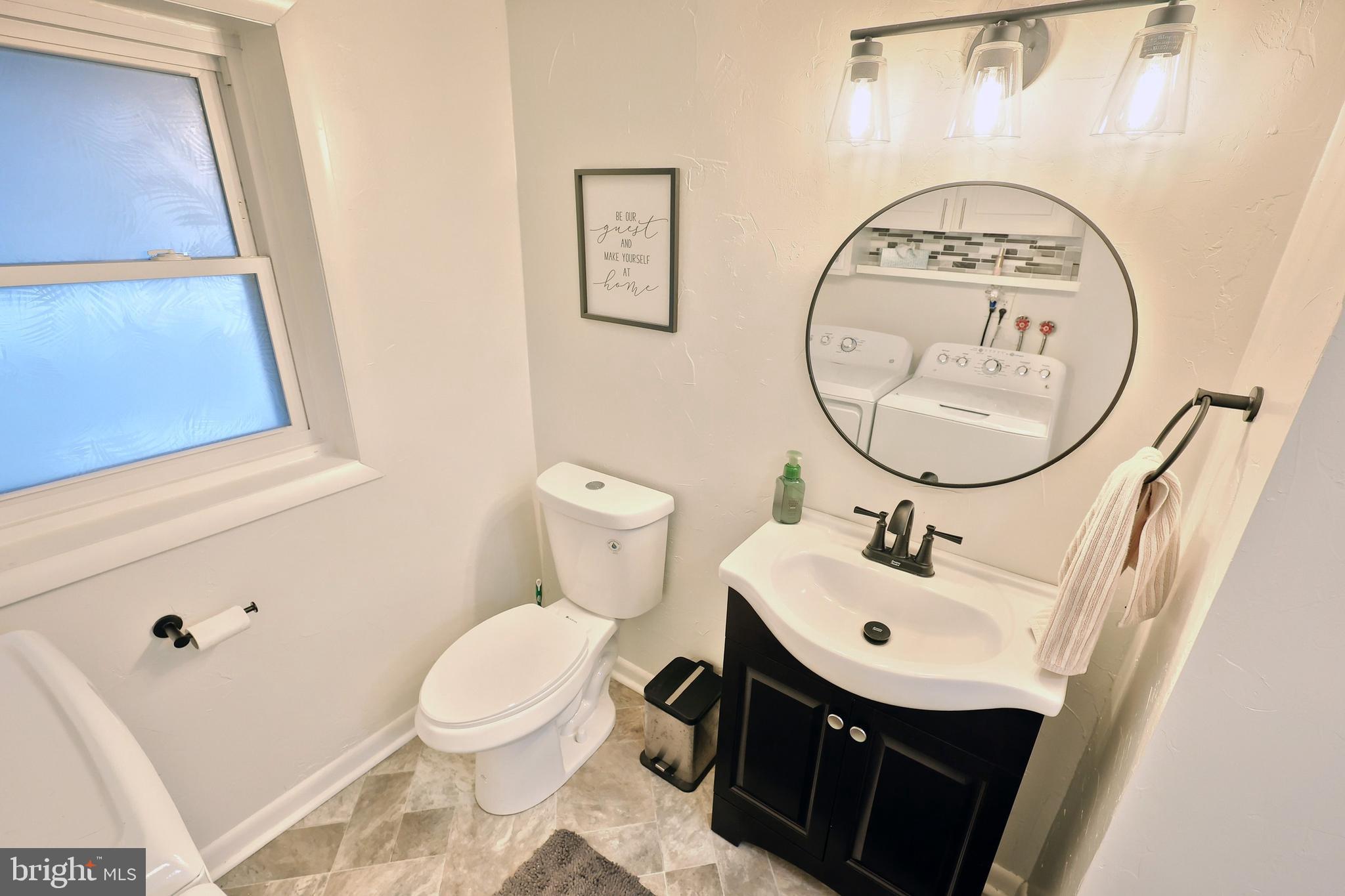 56 York Road York, PA 17407 - Photo 28 of 45 a bathroom with a sink toilet and a mirror