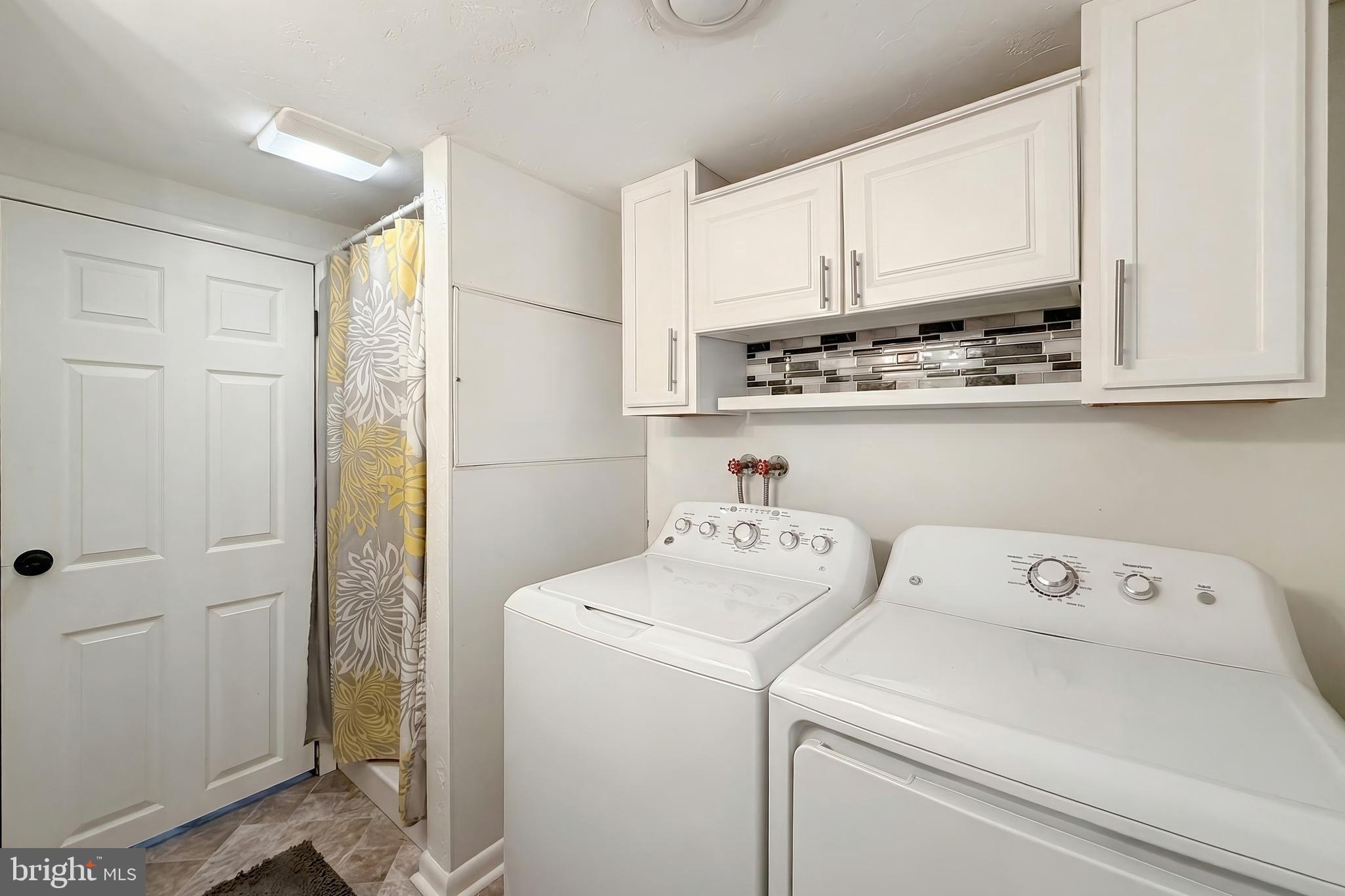 56 York Road York, PA 17407 - Photo 29 of 45 a view of storage and utility room with washer and dryer