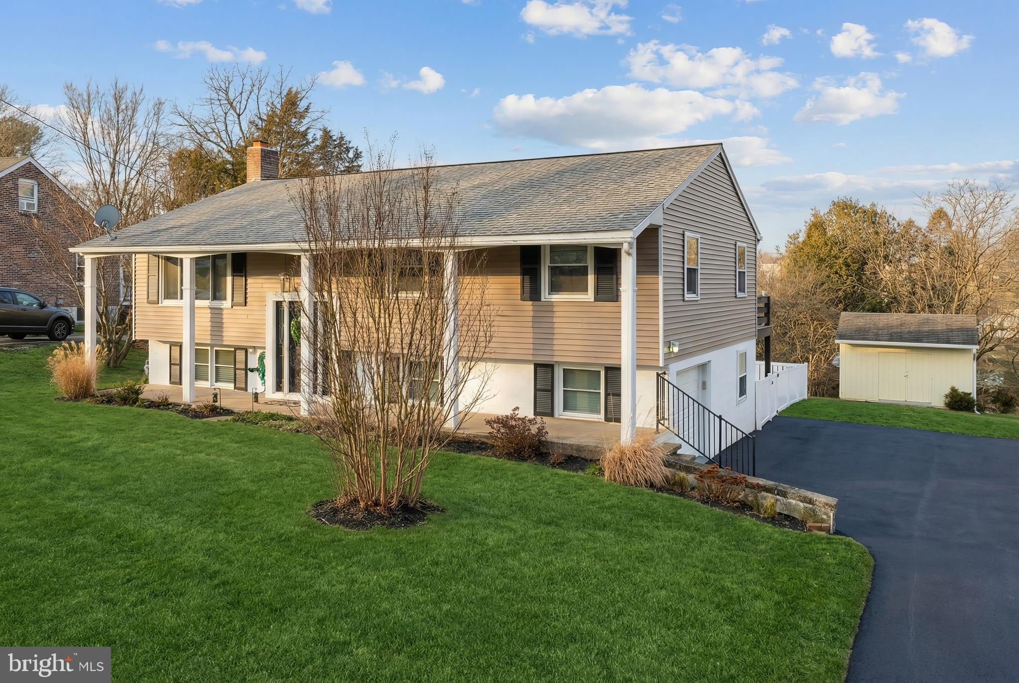 56 York Road York, PA 17407 - Photo 3 of 45 a front view of a house with a garden and yard