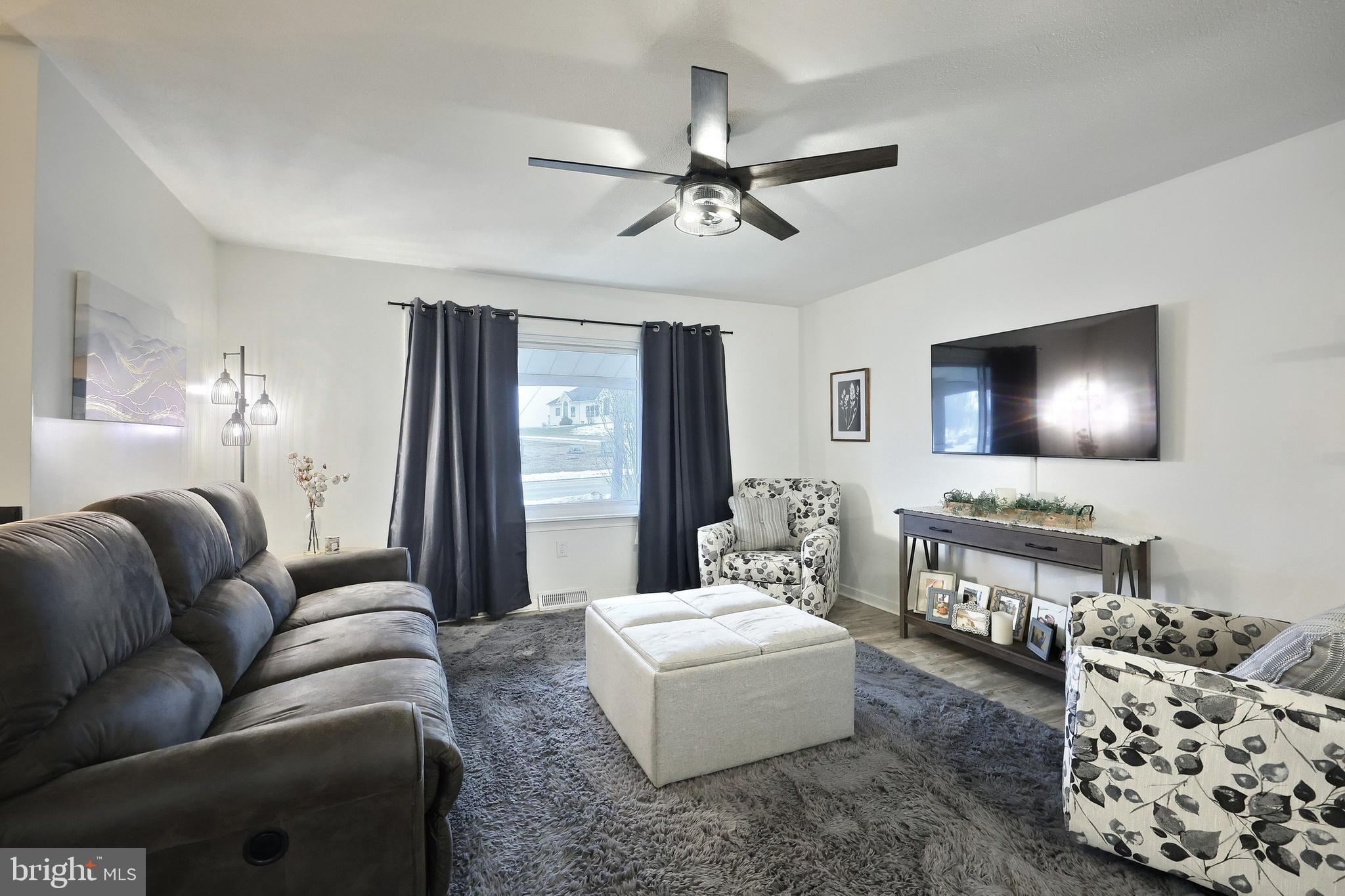 56 York Road York, PA 17407 - Photo 6 of 45 a living room with furniture and a flat screen tv