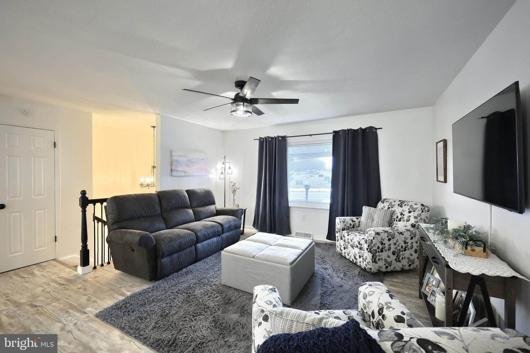 56 York Road York, PA 17407 - Photo 7 of 45 a living room with furniture and a flat screen tv