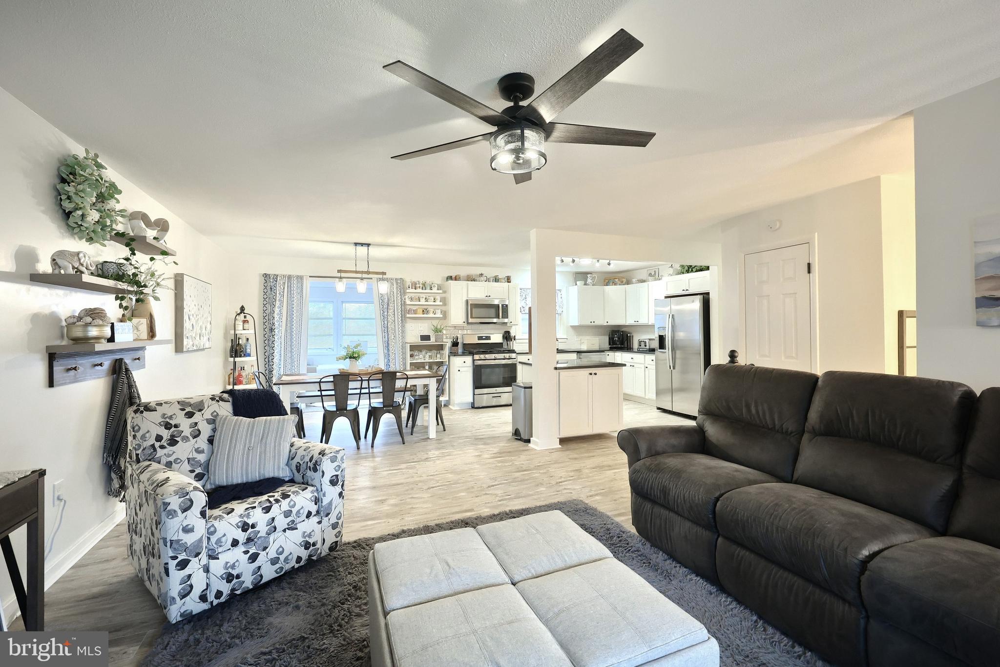 56 York Road York, PA 17407 - Photo 8 of 45 a living room with furniture kitchen view and a chandelier