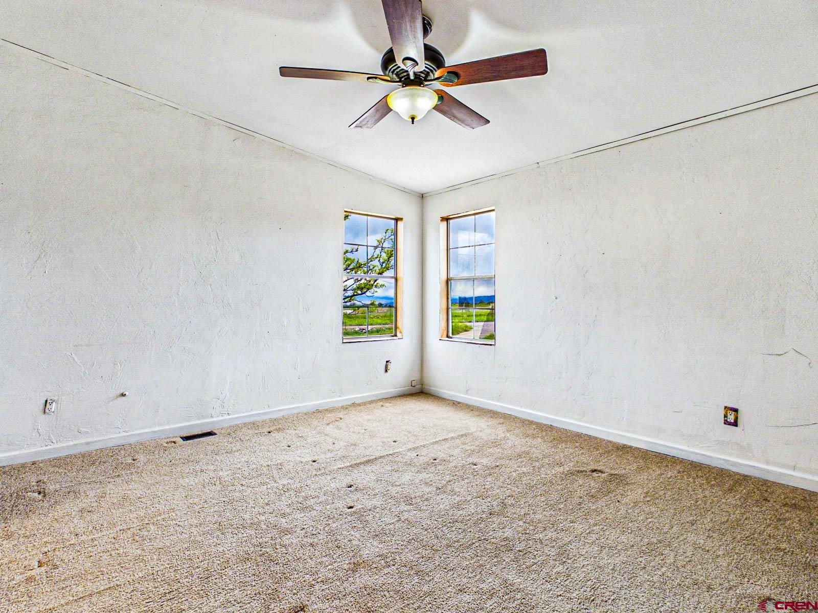 15484 Peach Road Cedaredge, CO 81413 - Photo 18 of 35 a view of an empty room with a window