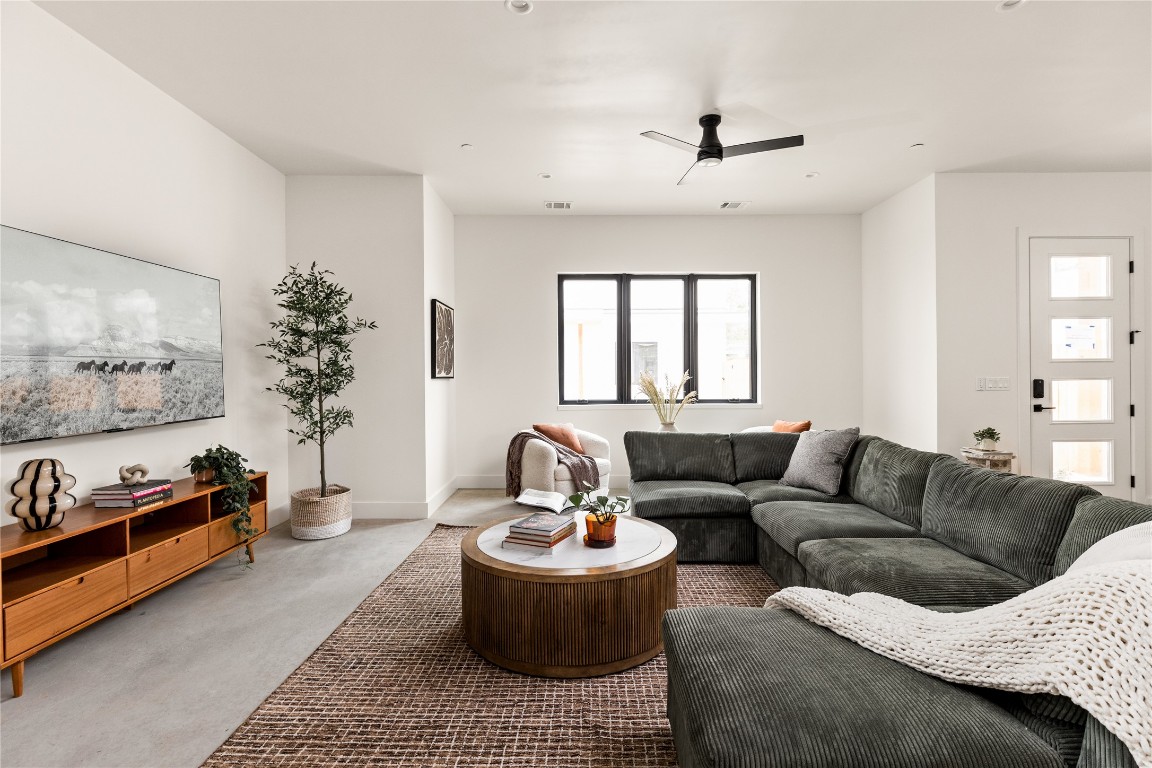 4416 South 1st Street, Unit 2 Austin, TX 78745 - Photo 11 of 40 Living room with ceiling fan and concrete floors