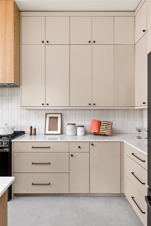 4416 South 1st Street, Unit 2 Austin, TX 78745 - Photo 13 of 40 Kitchen with gas range oven, backsplash, cream cabinets, and modern cabinets
