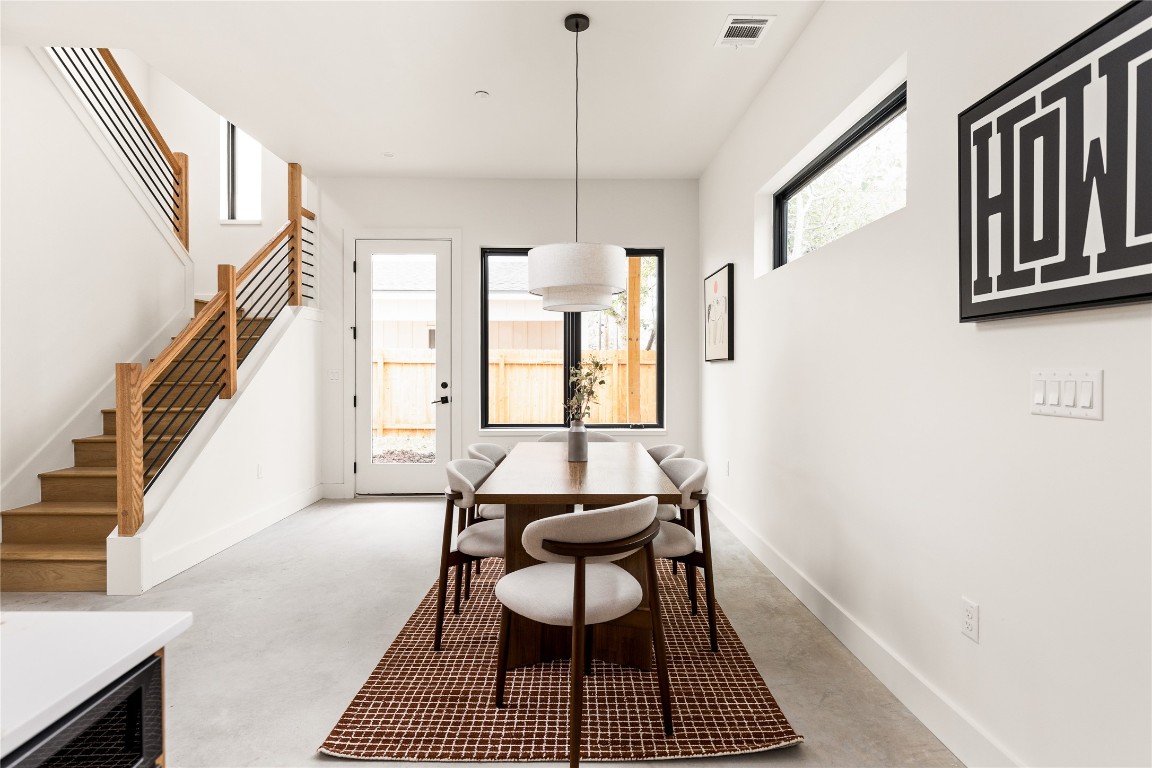 4416 South 1st Street, Unit 2 Austin, TX 78745 - Photo 16 of 40 Dining space with stairs and finished concrete floors