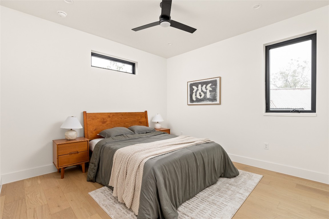 4416 South 1st Street, Unit 2 Austin, TX 78745 - Photo 25 of 40 Bedroom with light wood-style floors and a ceiling fan