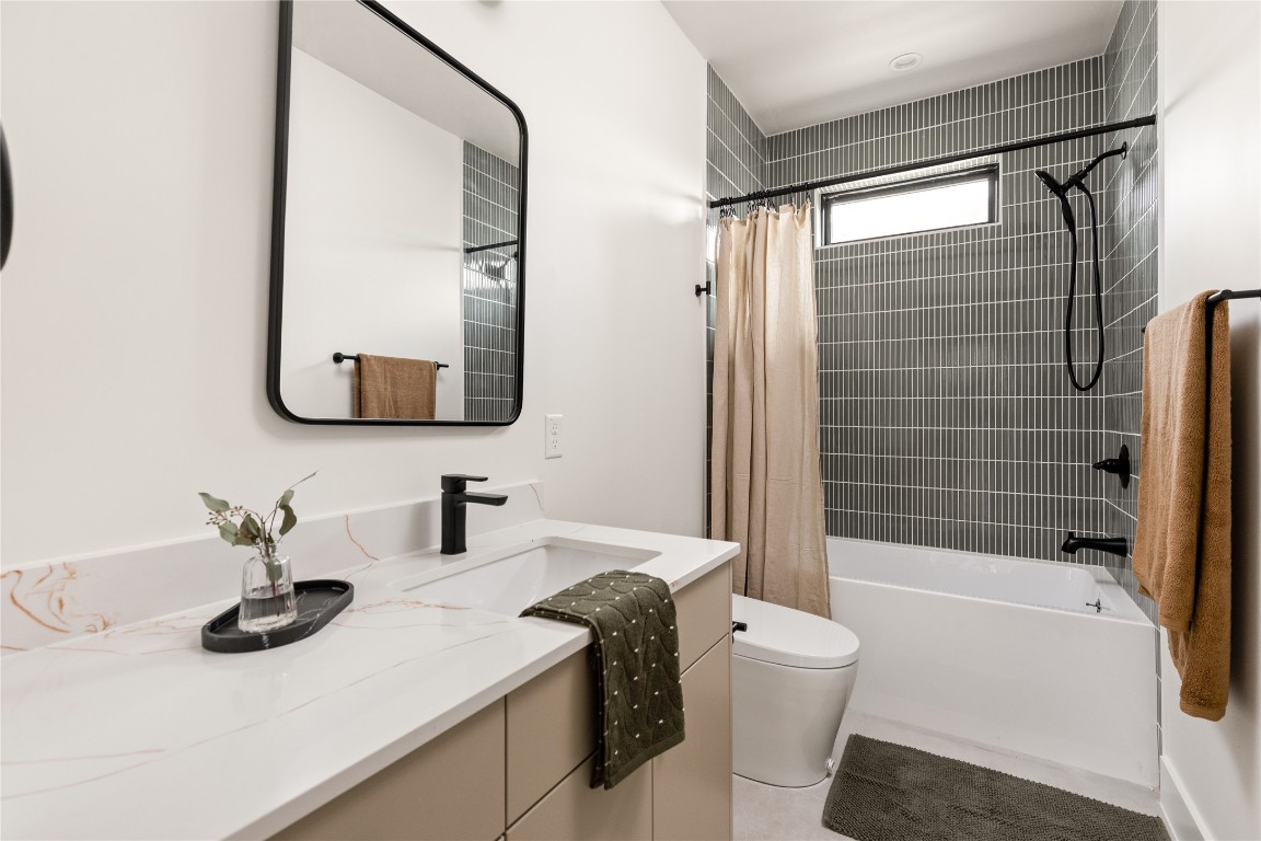 4416 South 1st Street, Unit 2 Austin, TX 78745 - Photo 26 of 40 Full bath featuring vanity and shower / bath combo