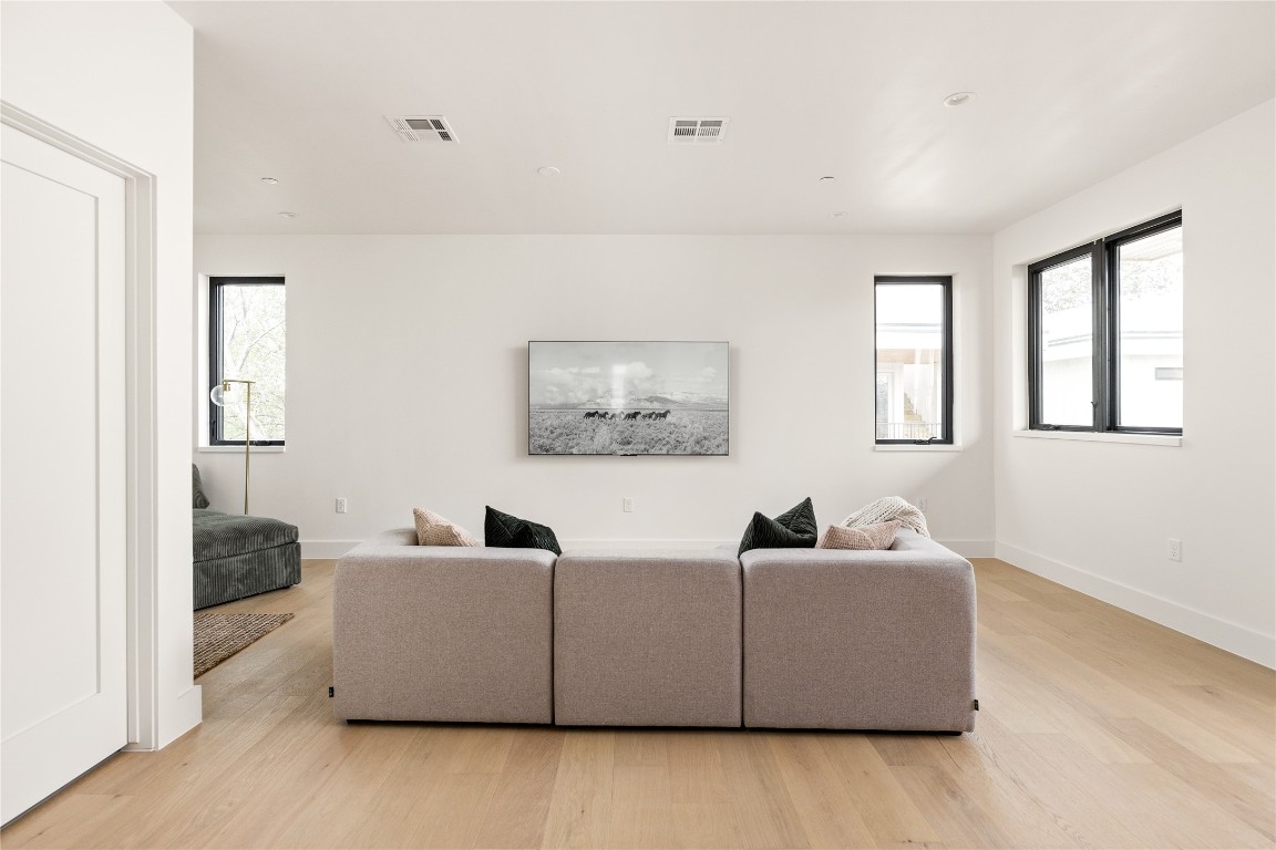 4416 South 1st Street, Unit 2 Austin, TX 78745 - Photo 29 of 40 Living area with light wood finished floors and recessed lighting