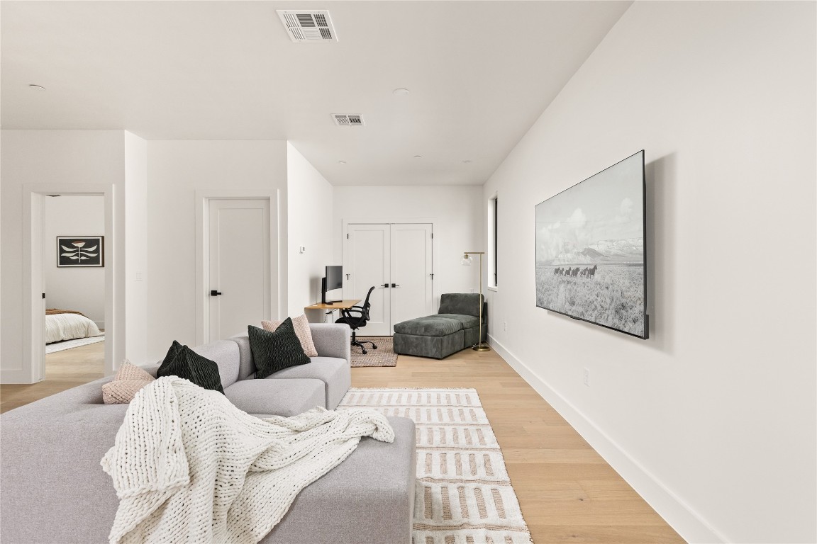 4416 South 1st Street, Unit 2 Austin, TX 78745 - Photo 31 of 40 Living room with a desk and light wood finished floors