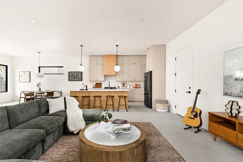 a living room with furniture and a table