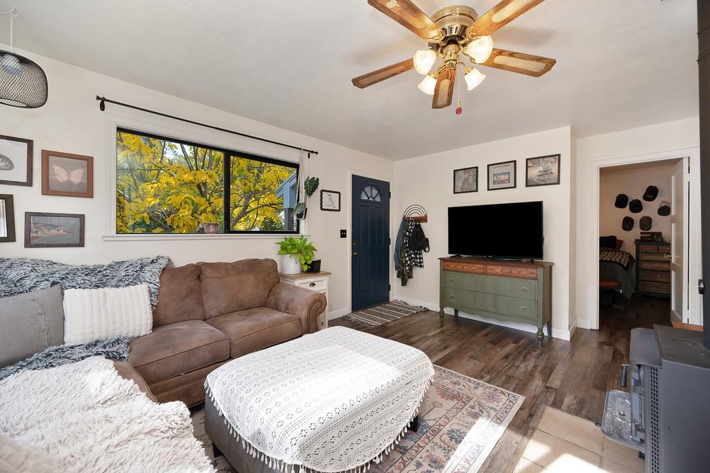 128 Main Street Gold Run, CA 95717 - Photo 11 of 44 a living room with furniture and a flat screen tv