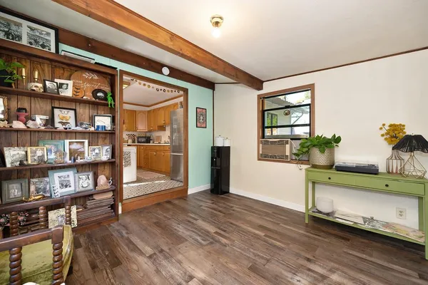 a view of an entryway with wooden floor