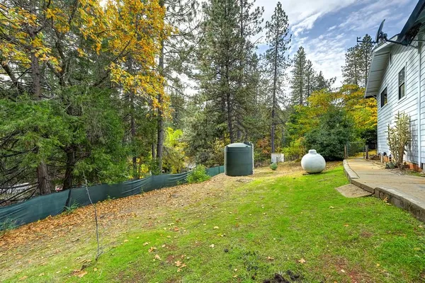 a view of a chair and table in the yard