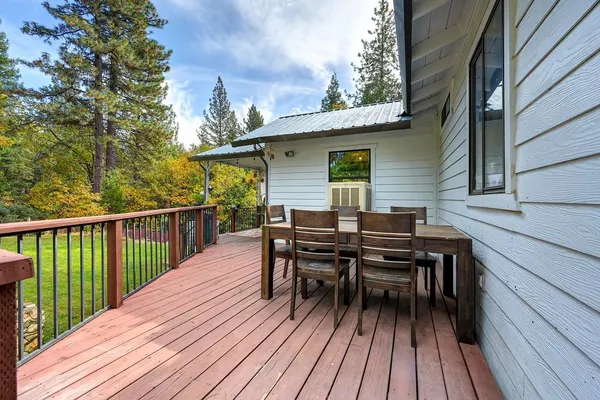 a view of a deck patio and outdoor seating