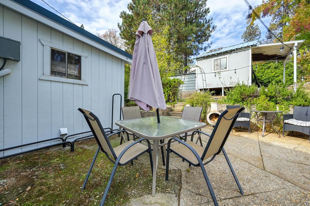 128 Main Street Gold Run, CA 95717 - Photo 34 of 44 a view of a backyard with sitting area