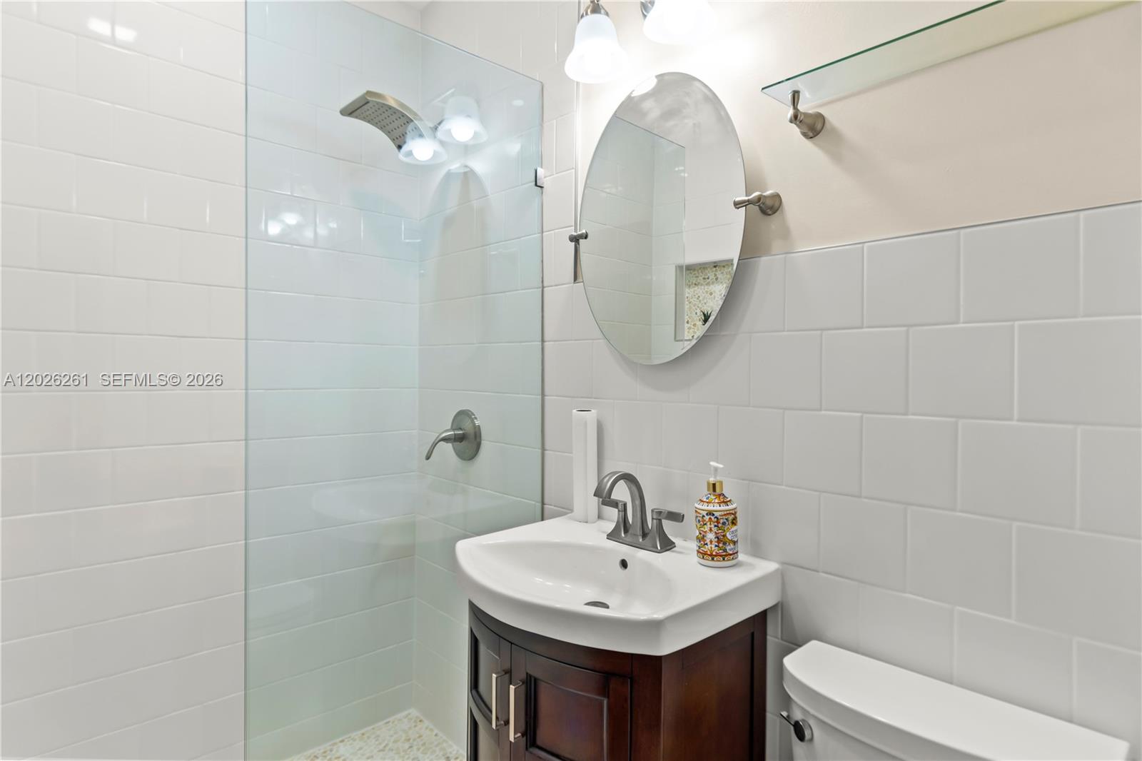 6250 Southwest 20th Terrace Miami, FL 33155 - Photo 21 of 42 a bathroom with a sink a toilet and a mirror