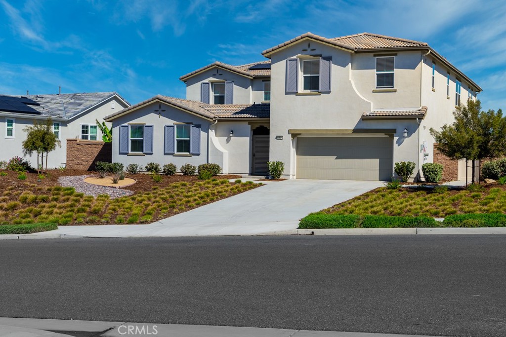 13814 Mardi Gras Lane Riverside, CA 92503 - Photo 1 of 1 a front view of a house with a yard