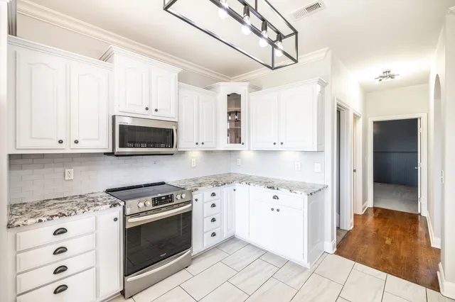 a front view of a house with a outdoor space