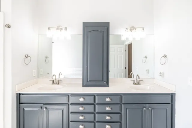 a view of a livingroom with a ceiling fan and window