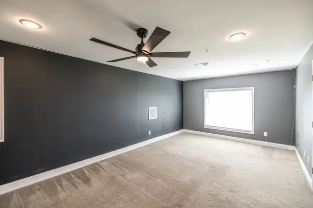 a view of a lake with a house in the background