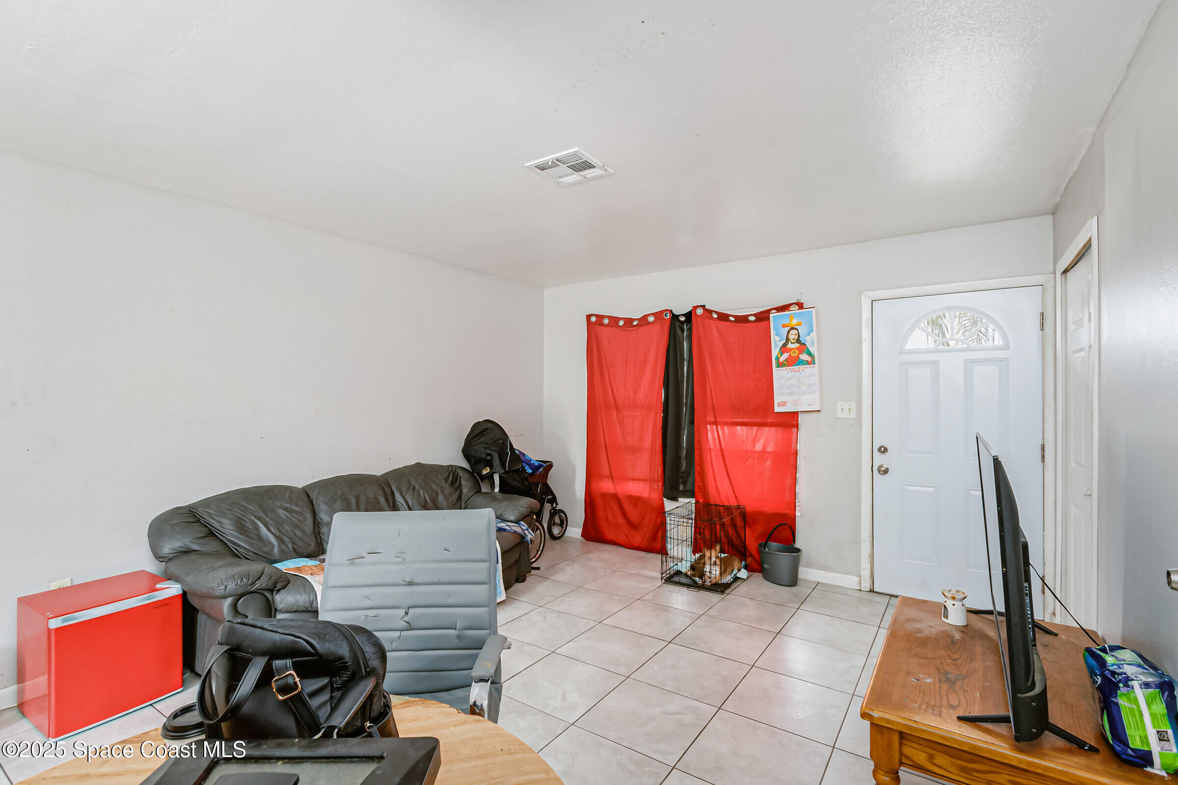 2465 Sarno Road Melbourne, FL 32935 - Photo 14 of 24 a living room with furniture