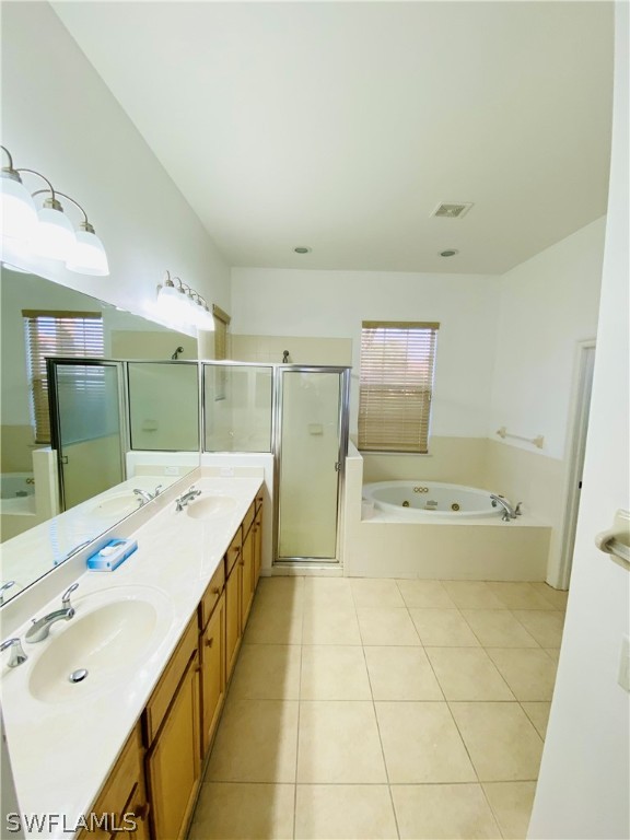 12914 Timber Ridge Drive Fort Myers, FL 33913 - Photo 15 of 21 a bathroom with a tub sink and mirror