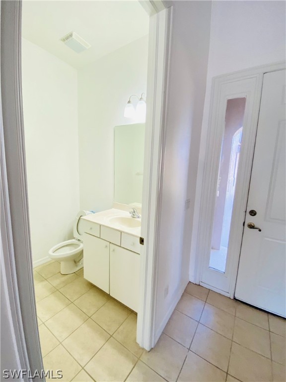 12914 Timber Ridge Drive Fort Myers, FL 33913 - Photo 16 of 21 a bathroom with a granite countertop toilet and a sink