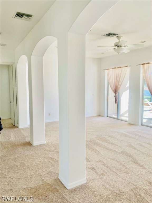 12914 Timber Ridge Drive Fort Myers, FL 33913 - Photo 5 of 21 a view of a room with wooden floor and windows