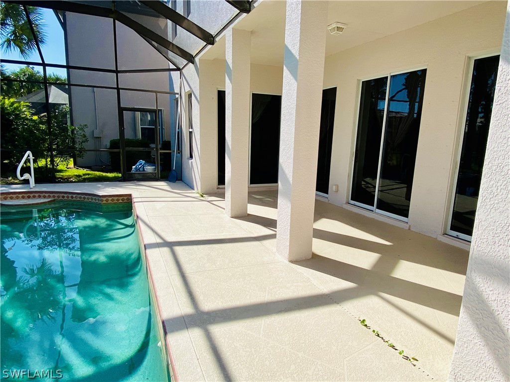 12914 Timber Ridge Drive Fort Myers, FL 33913 - Photo 8 of 21 a view of a porch with furniture and floor to ceiling window