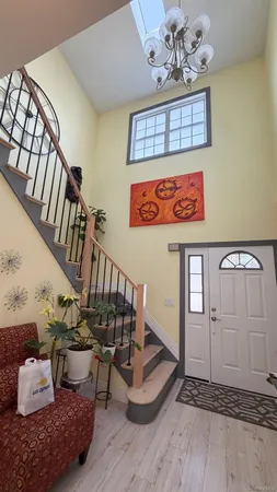 a view of an entryway with wooden floor