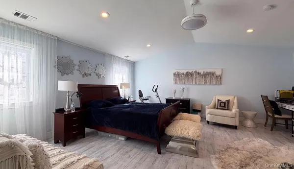 a bedroom with furniture and a bed