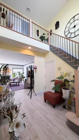 a living room with furniture and a book shelf