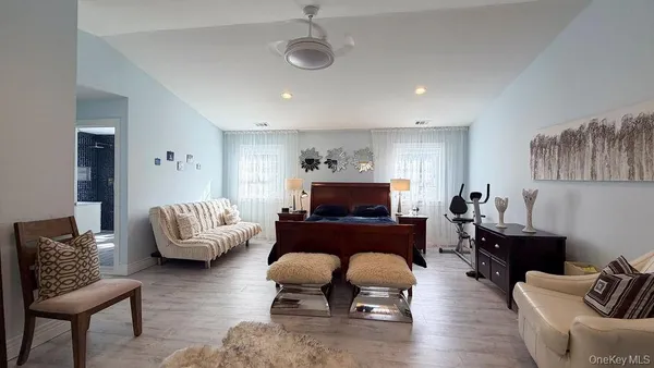 a living room with furniture fireplace and a table