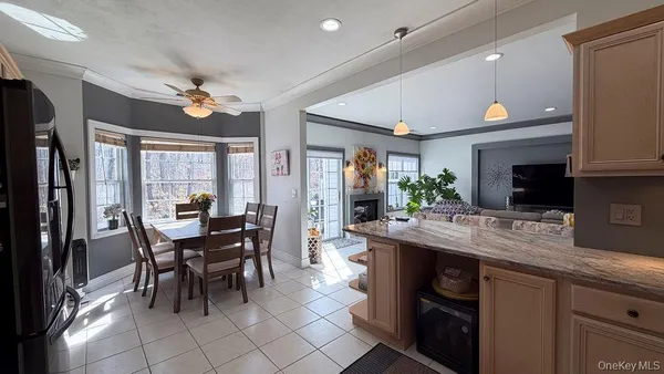 a kitchen with a table and chairs