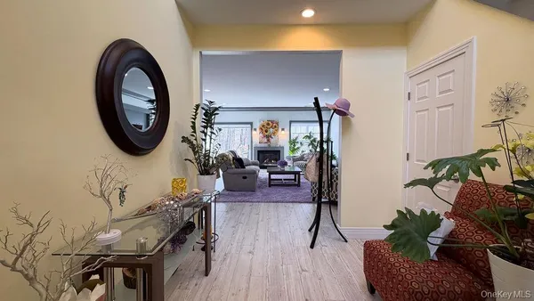 a view of a livingroom with furniture and a wooden floor
