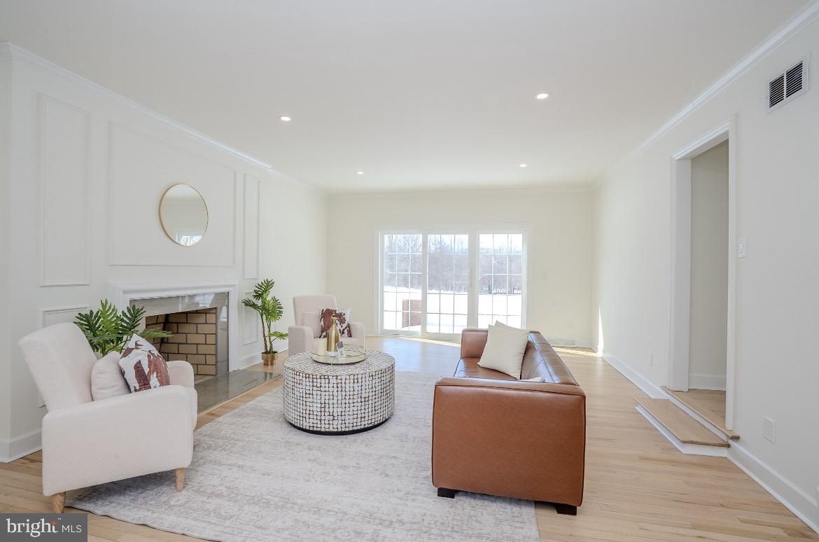 150 Windsor Road Robbinsville, NJ 08691 - Photo 12 of 60 a living room with furniture potted plant and a fireplace