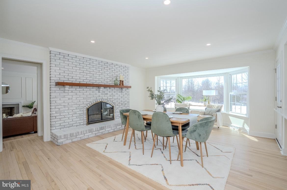 150 Windsor Road Robbinsville, NJ 08691 - Photo 14 of 60 a living room with furniture a fireplace and a table