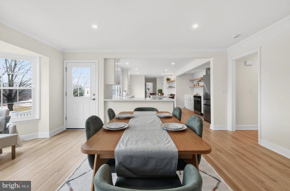 150 Windsor Road Robbinsville, NJ 08691 - Photo 16 of 60 a view of a dining room with furniture and wooden floor