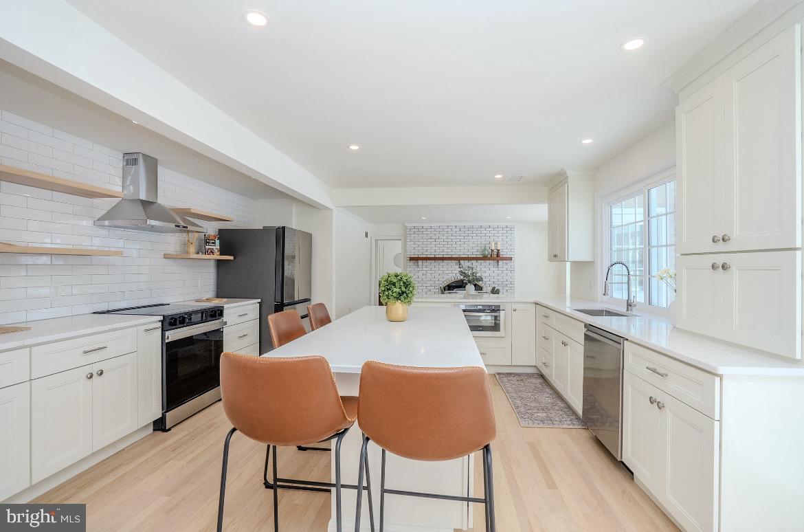 150 Windsor Road Robbinsville, NJ 08691 - Photo 18 of 60 a kitchen with stainless steel appliances kitchen island granite countertop a sink and cabinets