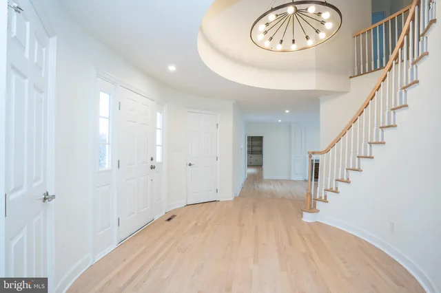 a view of a hallway with a chandelier