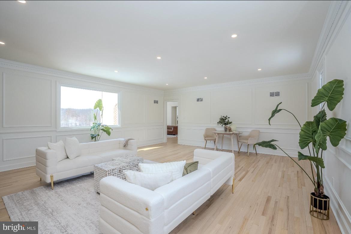 150 Windsor Road Robbinsville, NJ 08691 - Photo 24 of 60 a living room with furniture potted plant and a window
