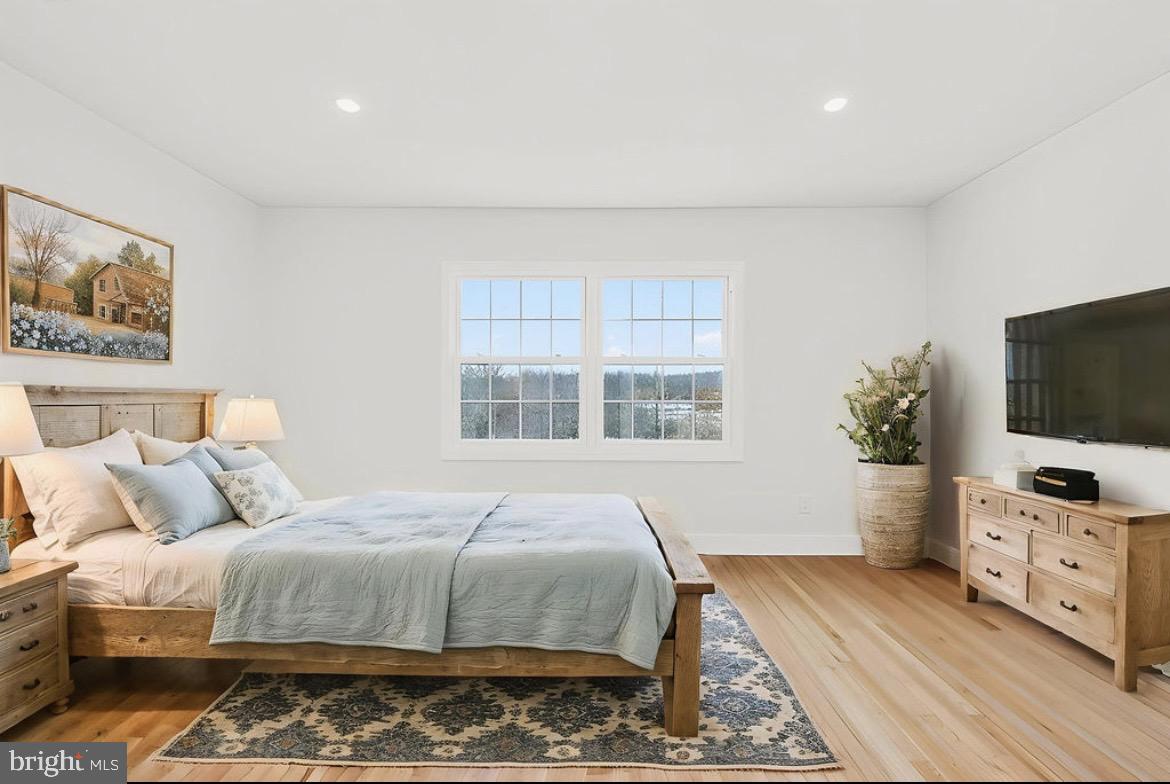 150 Windsor Road Robbinsville, NJ 08691 - Photo 33 of 60 a bedroom with a bed and a flat screen tv