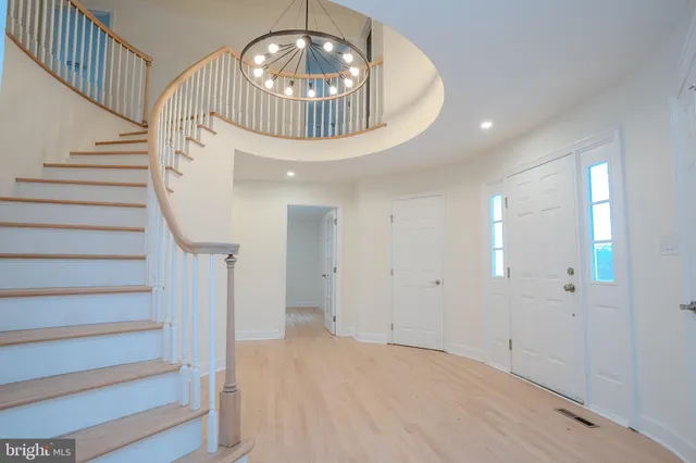 wooden floor in an empty room with a fireplace