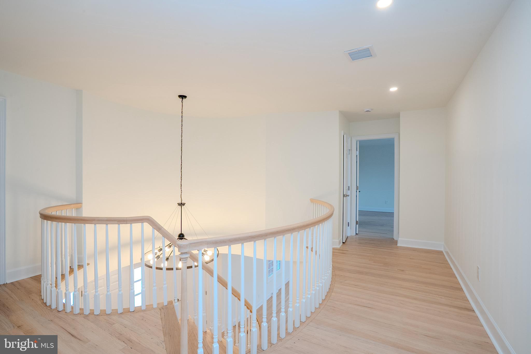 150 Windsor Road Robbinsville, NJ 08691 - Photo 41 of 60 a view of a hallway with a chandelier