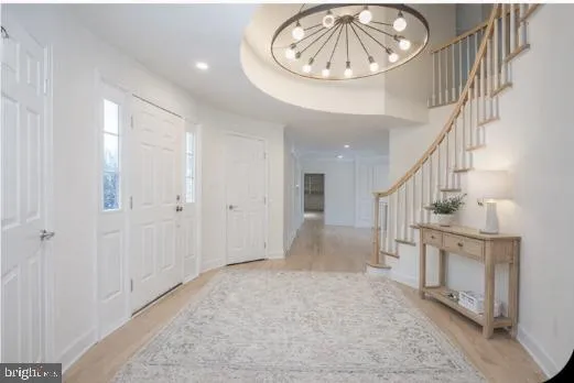 a view of empty room with wooden floor and fireplace