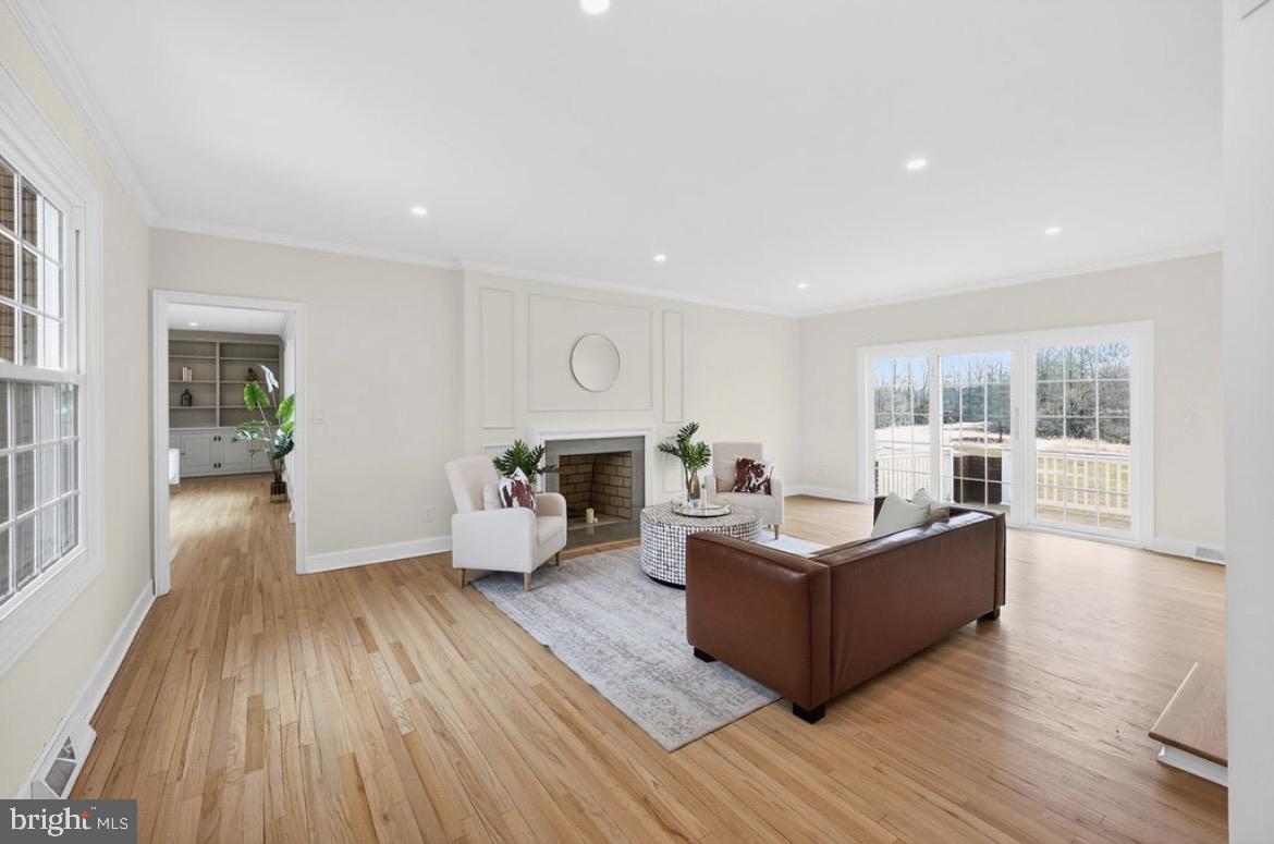 150 Windsor Road Robbinsville, NJ 08691 - Photo 10 of 60 a living room with furniture and a wooden floor