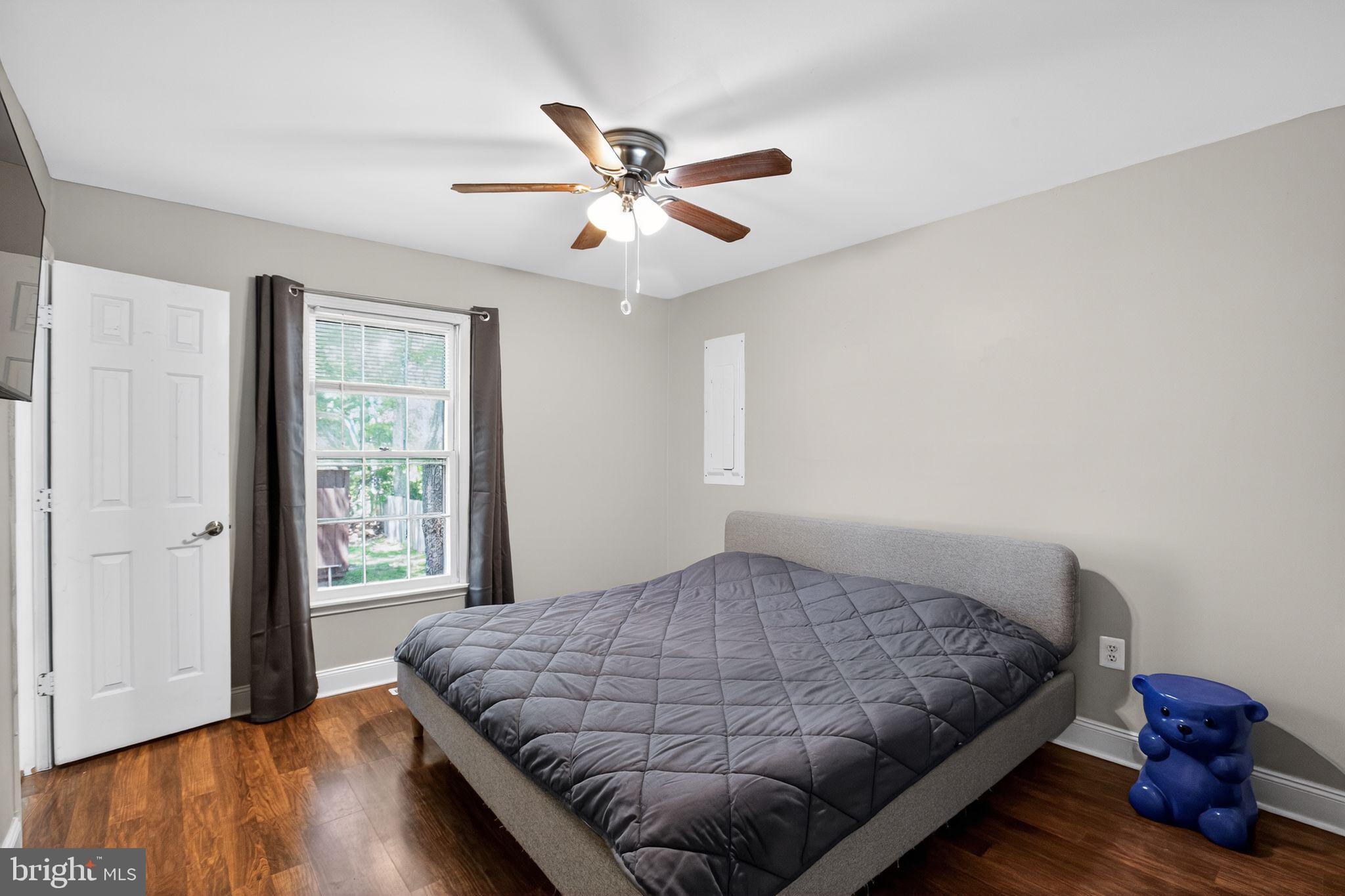 11789 Little Cove Point Road Lusby, MD 20657 - Photo 11 of 16 a bedroom with a bed and window