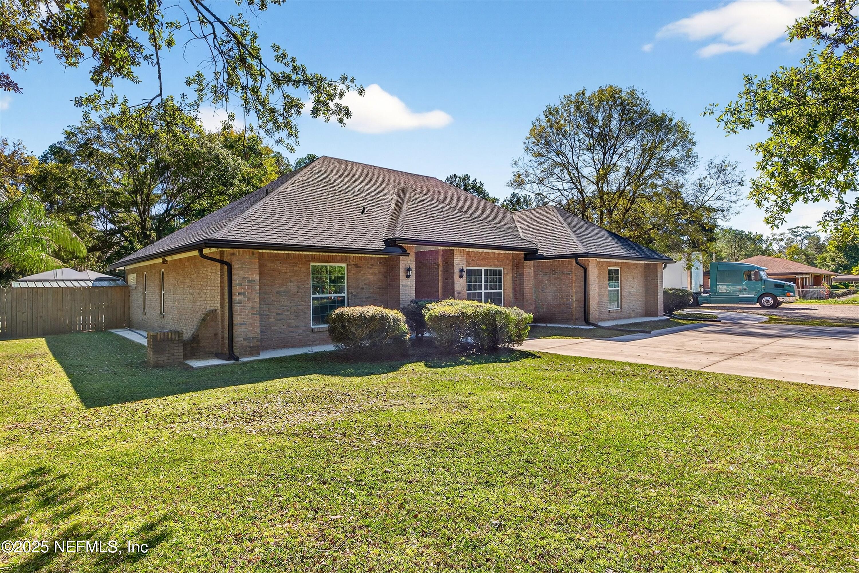 11341 V C Johnson Road Jacksonville, FL 32218 - Photo 1 of 70 a view of a house with a yard and sitting area