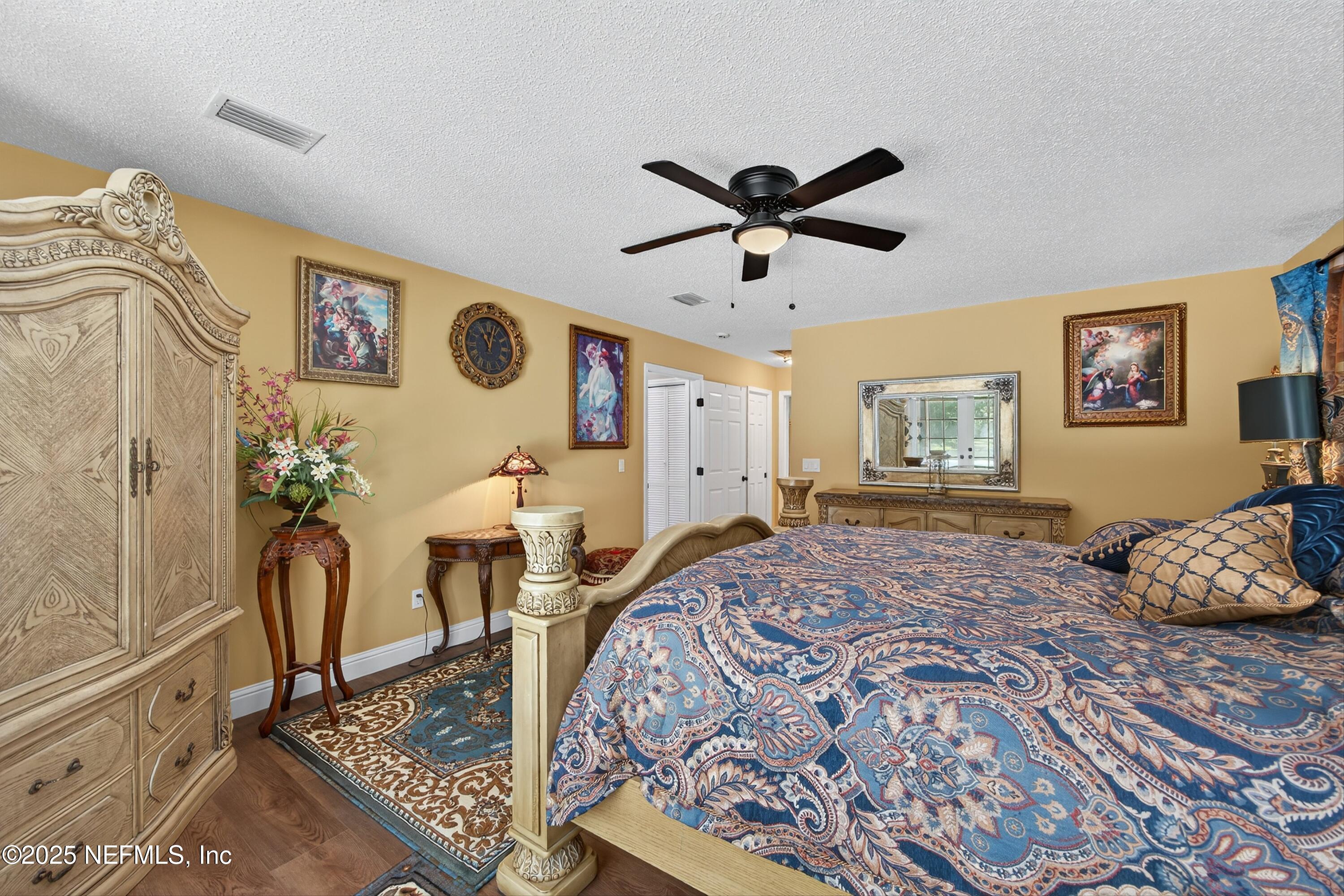 11341 V C Johnson Road Jacksonville, FL 32218 - Photo 20 of 70 a bedroom with a bed dresser and window